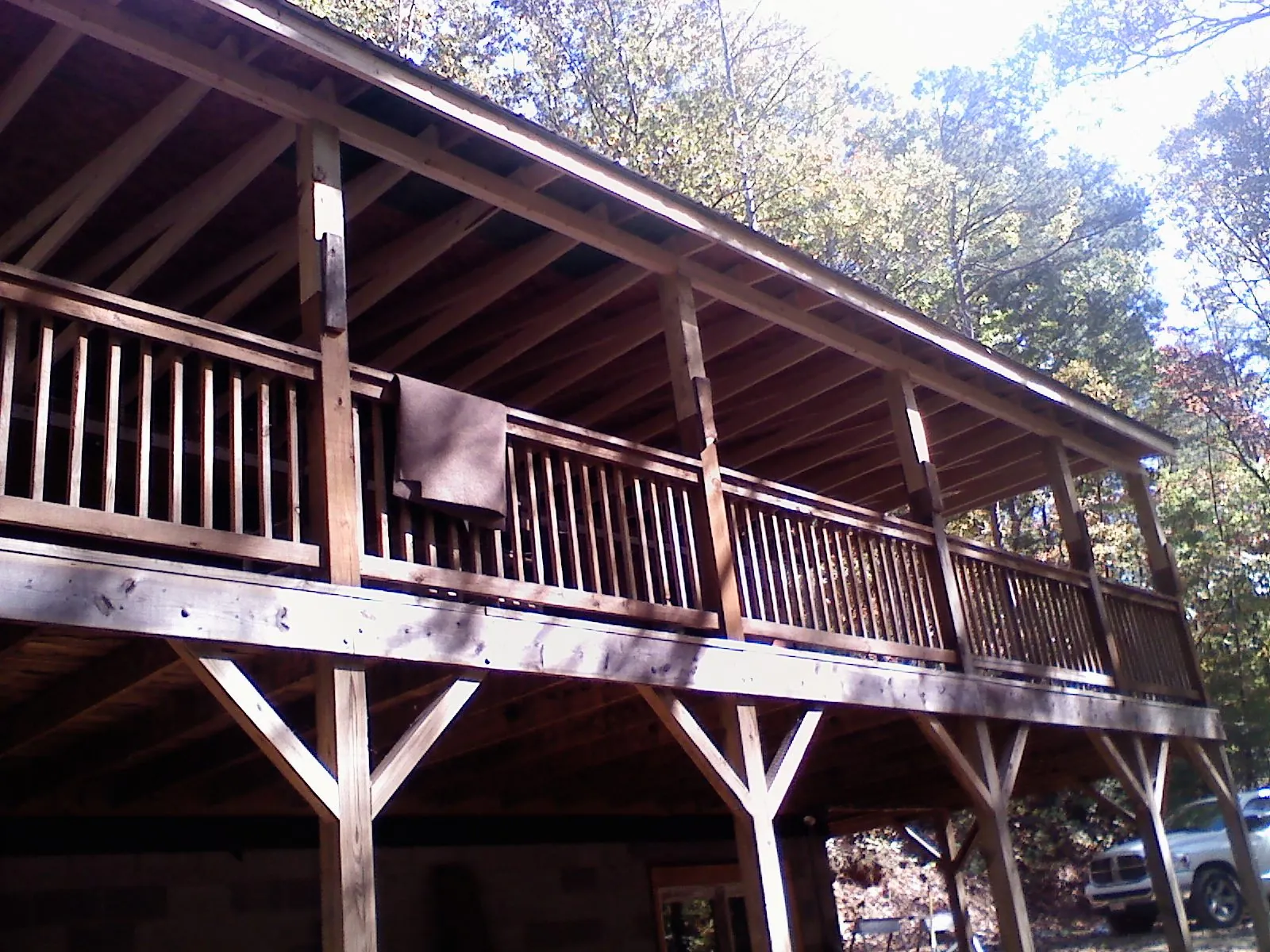 Timber framing under a new elevated porch and deck — Roof Leak Repair in Marcy by Roofing Brothers